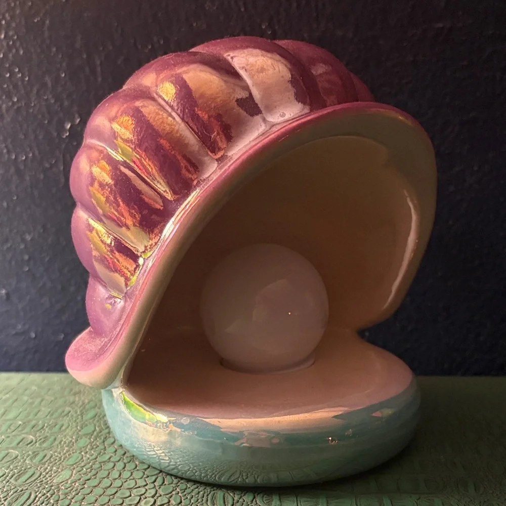 Violet oyster shell with magnificent illuminated pearl
